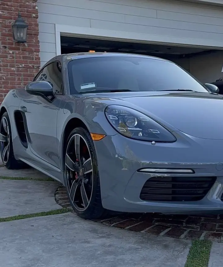 Front of a grey Porsche 718 with glossy paint and clean wheels